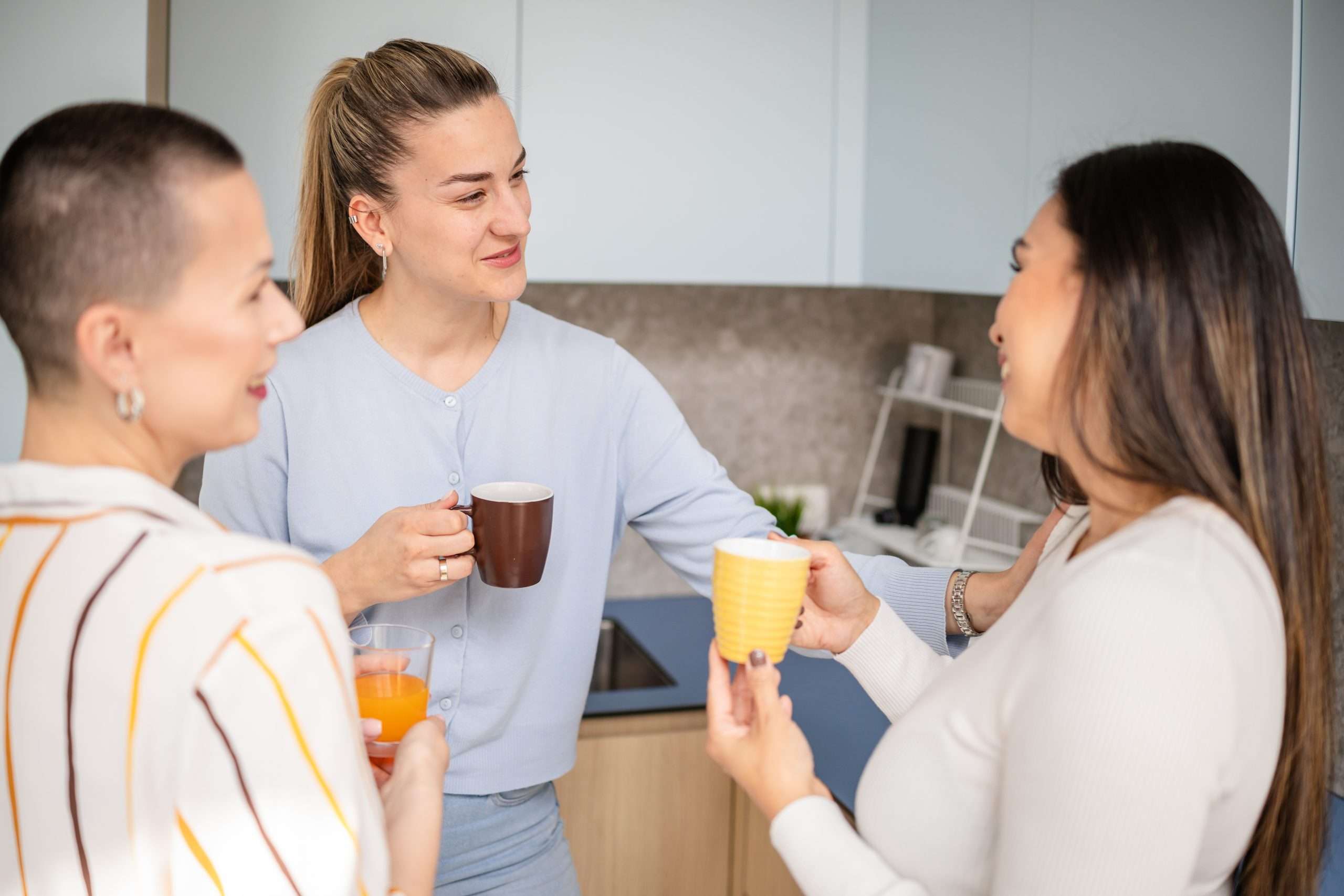Women in sober living in Frisco TX drinking coffee in the kitchen